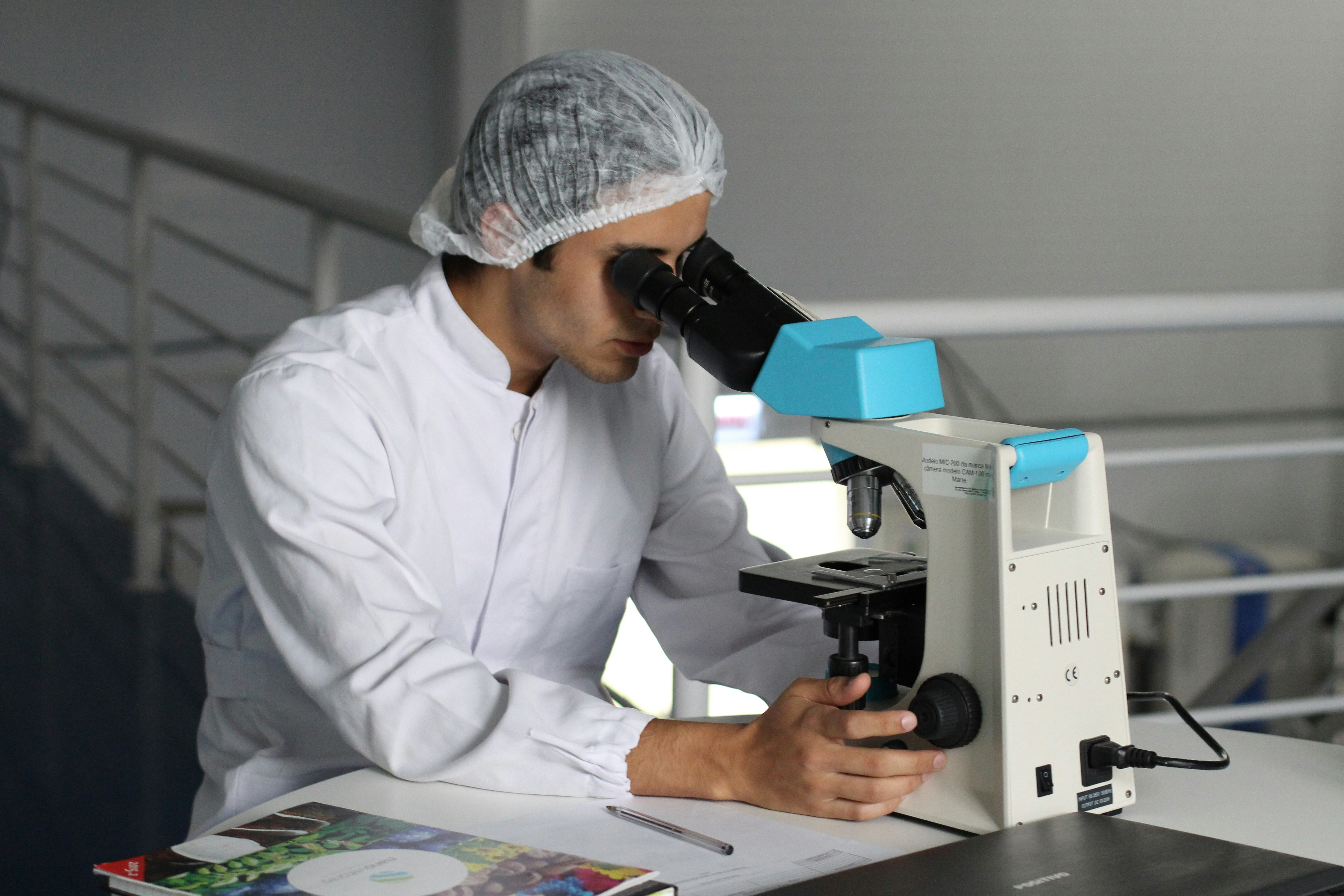 Researcher working at a microscope